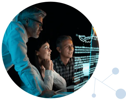 Scientists looking at data on a screen