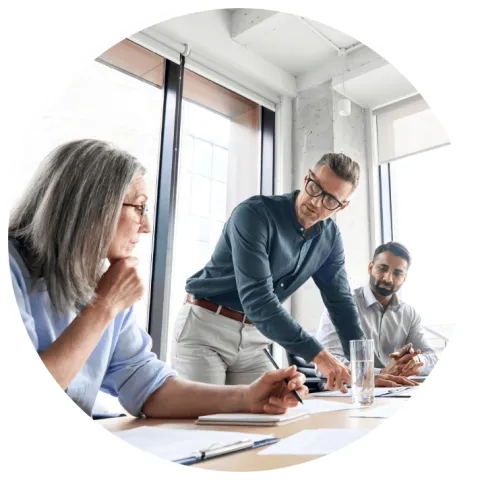 Three people in a meeting room